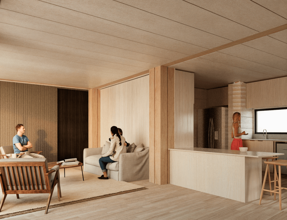 Espacio interior acogedor de una casa modular, con un diseño moderno y funcional que integra una sala de estar y una cocina. La disposición abierta fomenta la interacción familiar, ideal para una segunda vivienda. Este ambiente se caracteriza por su luminosidad y calidez, resaltando la comodidad de vivir en una vivienda prefabricada. Tecno Fast Home.
